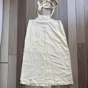 we wore what Cream linen apron dress